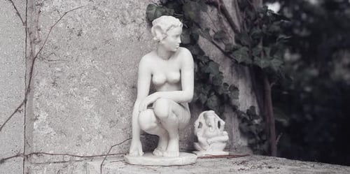 Crouching Sculpture of Woman Next to Elephant Deity