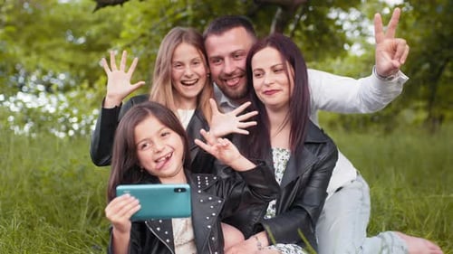 Happy Family Taking Selfie in Nature