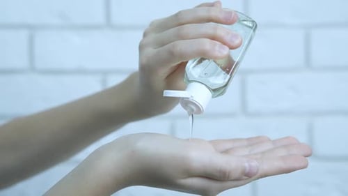 Applying Hand Sanitizer for Cleanliness and Hygiene