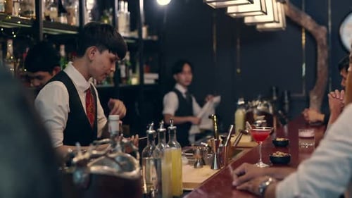 4K Group of People enjoy hangout nightlife at luxury bar.