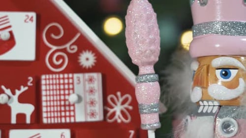 Wooden Tree Advent Calendar in Front of a Real Christmas Tree Decorated Nutcracker Soldier Toys. Fai