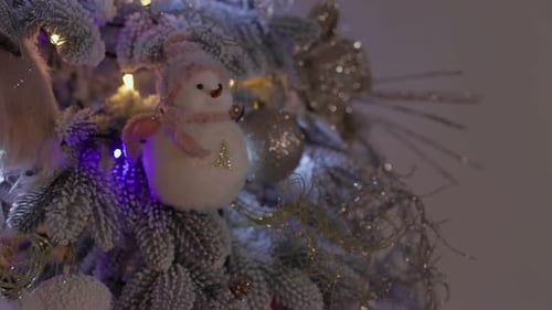 Festive Christmas Tree with Snowman Ornament