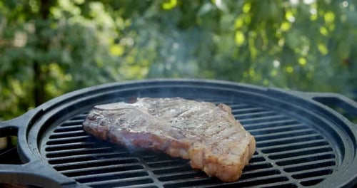 Delicious Steak Sizzling on an Outdoor Grill