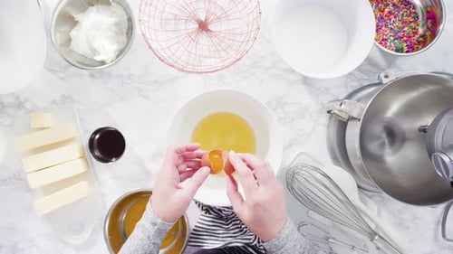 Flat lay. Step by step. Mixing ingredients in standing kitchen mixer to make funfetti cake.
