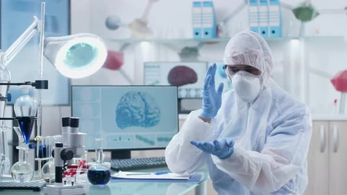 Scientist Wearing AR Glasses Looks and Learng Through Augmented Reality