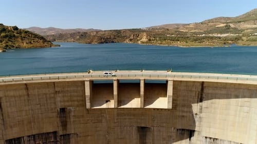 Aerial Drone Shot of Beautiful Dam Water and Road