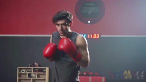 Caucasian sportsman athlete workout, exercise doing boxing and practice punch for health in gym.