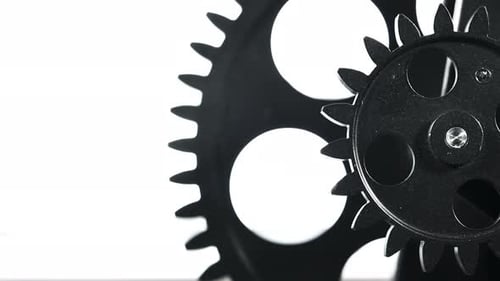 Meshing Black Gears Spinning in a Close Up Shot