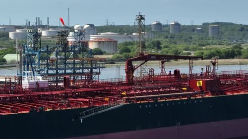 Petroleum Tanker Vessel Offloading Fuel and Oil at a Refinery Port