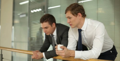 Businessmen Talking During Break in Modern Office