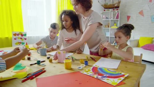 Children Doing Art Projects with Teacher