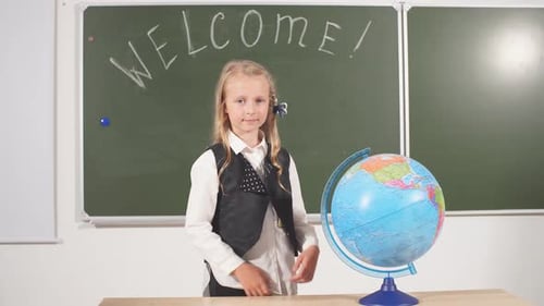 Back To School Concept. Schoolgirl Chalkboard in Classroom.