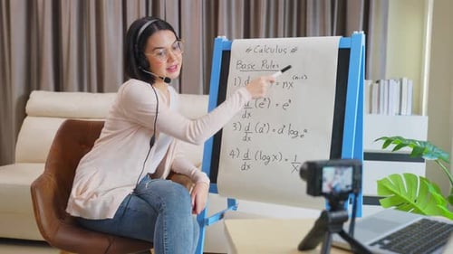 Asian school young woman teacher working from home teach online math subject to student