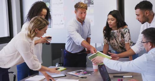 Professional businesspeople discussing together in modern office in slow motion