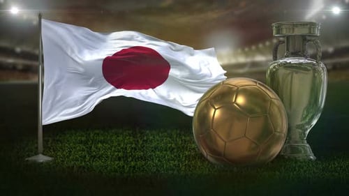 Waving Japan Flag, Golden Football, and Silver Trophy in Stadium