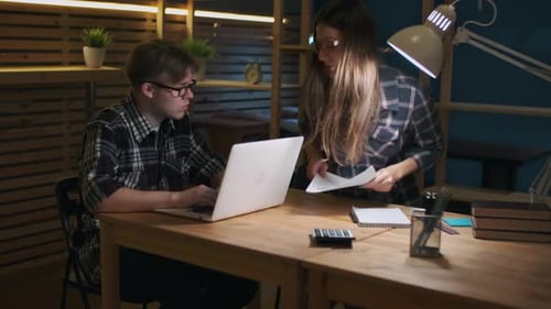 Teamwork in Modern Office at Night