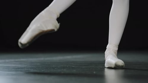 Ballet Dancer Performing Footwork On Stage