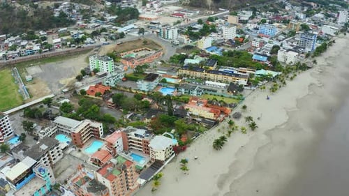 Aerial view of a small village alongside the beach