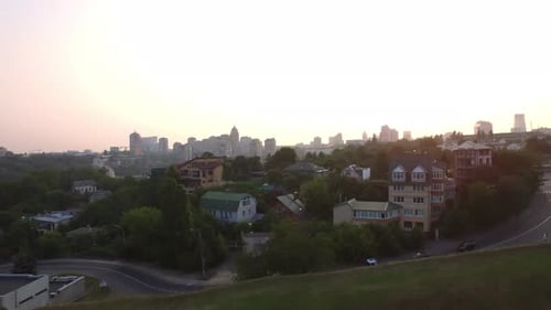 Drone View of Evening City Landscape. Aerial View Urban Architecture at Sunset