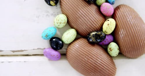 Chocolate Easter eggs on wooden plank
