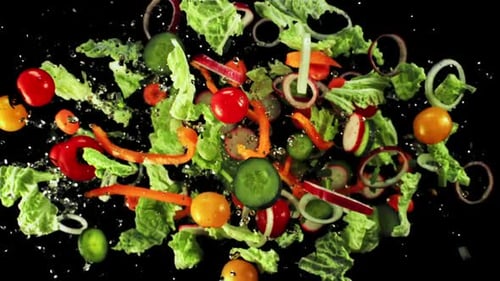 Floating Salad with Fresh Vegetables on Black Background
