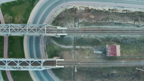 Railway road, top view. Train tracks and railway bridge across the river
