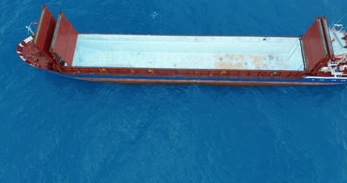 Freight Ship Floating on Sea. Aerial View.