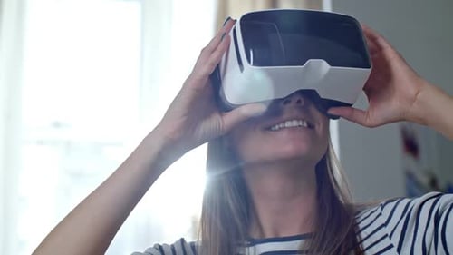 Woman Wearing Virtual Reality Headset Indoors