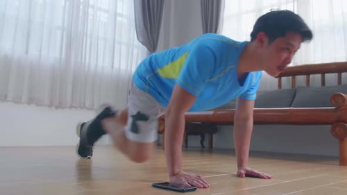 Man Doing Mountain Climber Exercises At Home