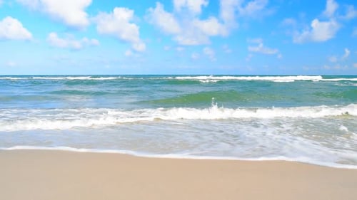 Gentle Waves on a Peaceful, Sandy Beach