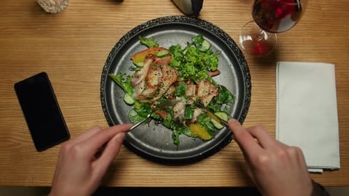 Man Eating Tasty Dinner at Restaurant Table