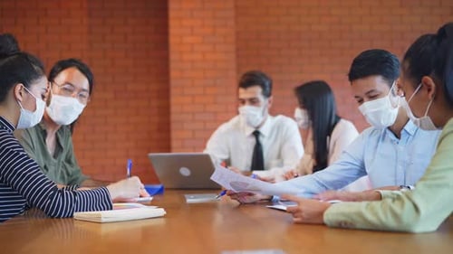 Asian teamwork business people working in office with new normal lifestyle have brainstorm meeting