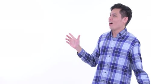 Happy Young Asian Hipster Man Touching Something and Looking Surprised