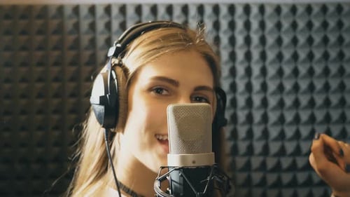 Portrait of Beautiful Girl Singing in Sound Studio