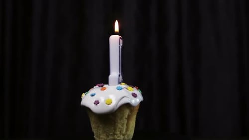 Festive Cupcake with Number One Candle Burning