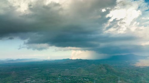 Aerial view Summer Thunderstorm and Black clouds moved over the mountains.