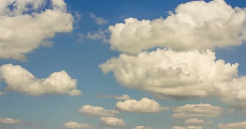 Time Lapse of White Clouds Drifting Across Blue Sky