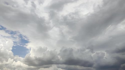 Clouds Moving Slowly Across a Blue Sky