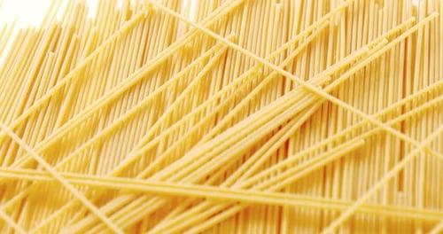 Golden Spaghetti Noodles Forming a Unique Pattern