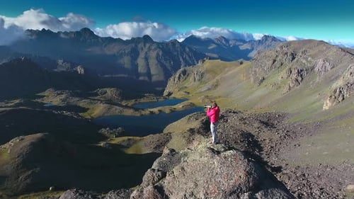 Photographer on Top of Mountain