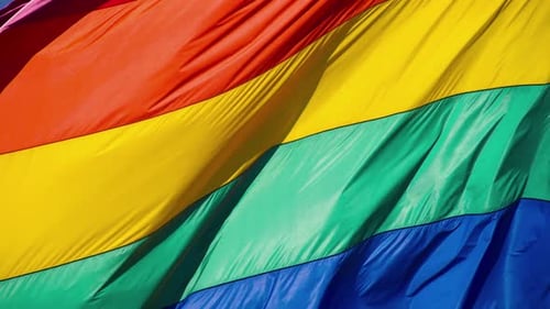 Rainbow Flag Waving Symbolizing Diversity and Inclusion