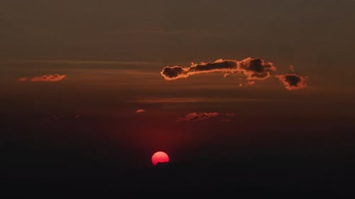 Majestic Sunrise Above a Sea of Clouds