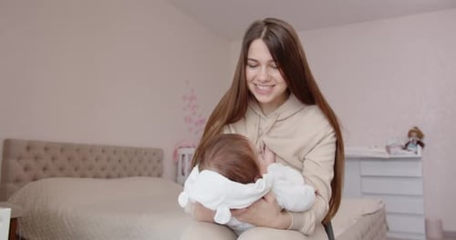 Mother Breastfeeding Baby with Love and Tenderness
