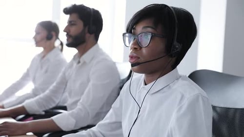 People Work At Contact Center. Woman In Headset Working