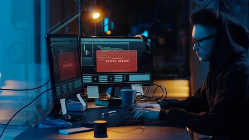 Hacker Using Computer for Cyber Attack at Night 22