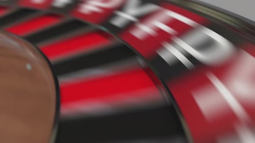 Ball in Pound Sterling Sign Pocket on Casino Roulette Wheel