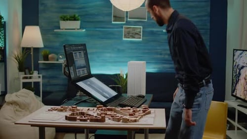 Architect Analyzing Building Model on Touch Screen Monitor