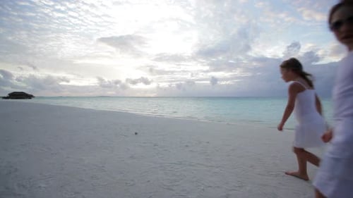 Family Togetherness at the Beach at Sunset