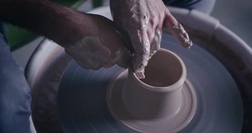 Potter Shaping Clay on a Wheel Close Up