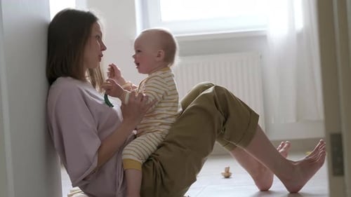 Woman and Baby Interacting in Home